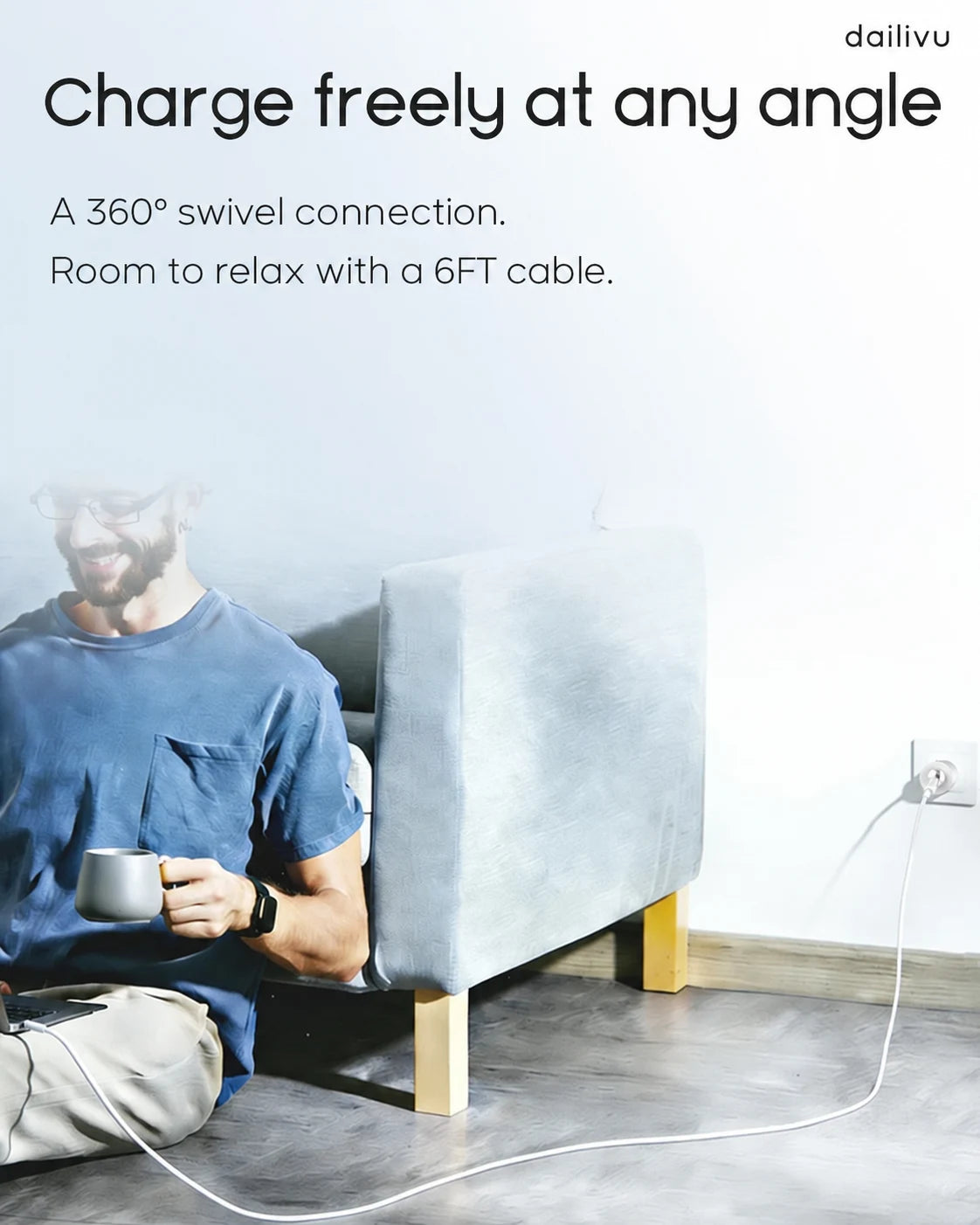 A seated person using a device with a long cable connected to a magnetic wall charger