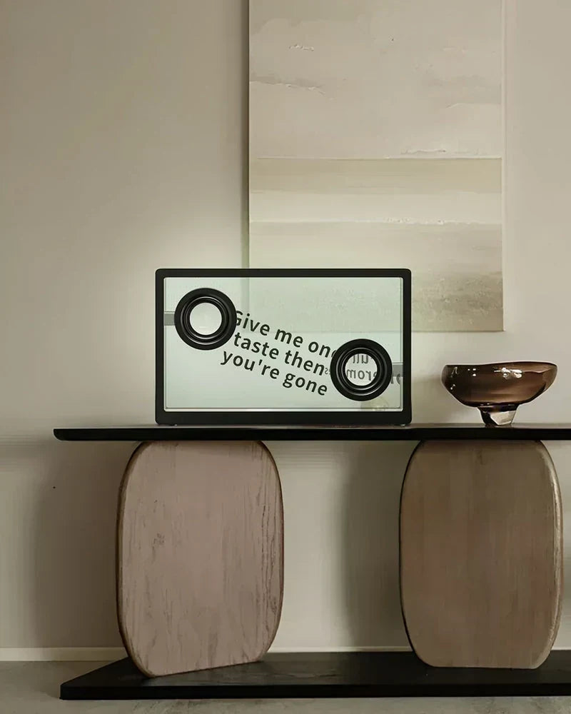 Speaker displaying angled lyrics in a warm minimalist interior