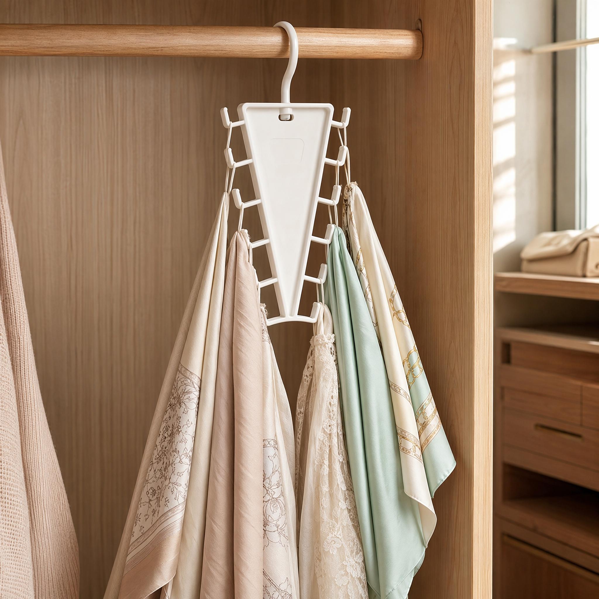 V-shaped closet organizer hanging on a wardrobe rod