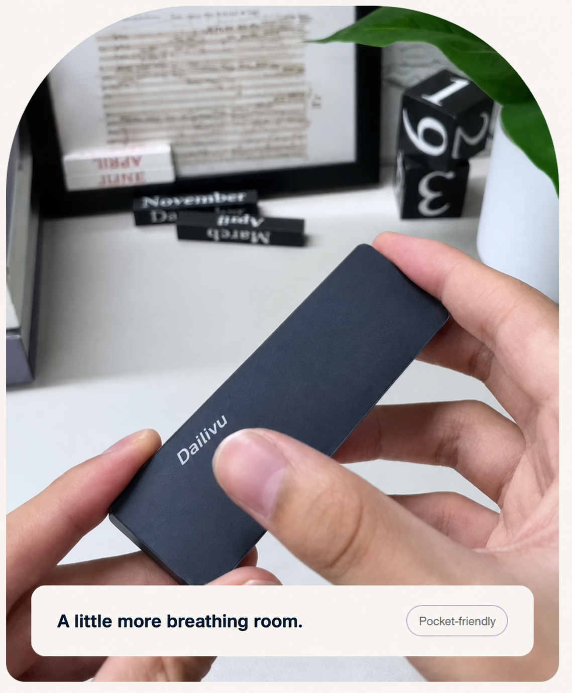 Dailivu portable drive held in two hands. A little more breathing room. Pocket-friendly.